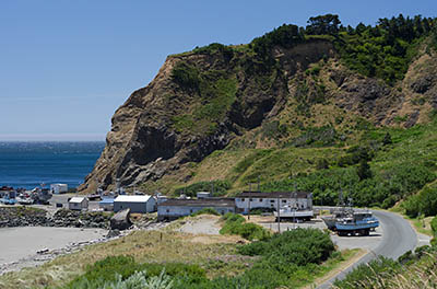 OR: South Coast Region, Curry County, North Coast, Port Orford Area, Town of Port Orford, Fort Point, Battle Rock, Sand beach a block from downtown, with views towards marina below sea cliffs [Ask for #274.395.]