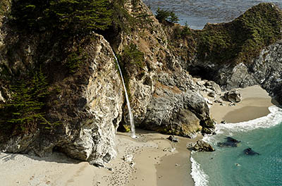 CA: South Coast Region, Monterey County, Los Padres National Forest, Big Sur, McWay Cove, Julia Pfeiffer Burns State Park, Waterfall flows over cliffs onto beach [Ask for #271.062.]