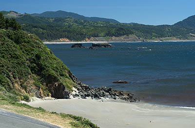 OR: South Coast Region, Curry County, North Coast, Port Orford Area, Town of Port Orford, Fort Point, Battle Rock, Sand beach a block from downtown, with views towards sea cliffs [Ask for #274.390.]