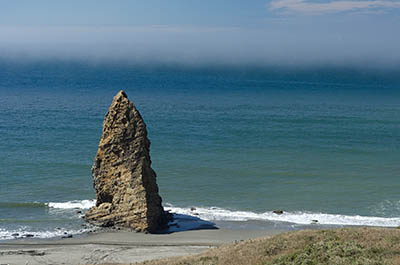 OR: South Coast Region, Curry County, North Coast, Cape Blanco Area, Cape Blanco State Park, Hoodoo and beach at the base of the cliff. [Ask for #274.665.]