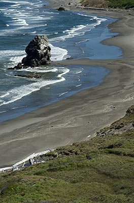 OR: South Coast Region, Curry County, North Coast, Cape Blanco Area, Cape Blanco State Park, View of Cape Blanco with its quiet, protected beach, large hoodoos, and grass-topped cliffs [Ask for #274.682.]