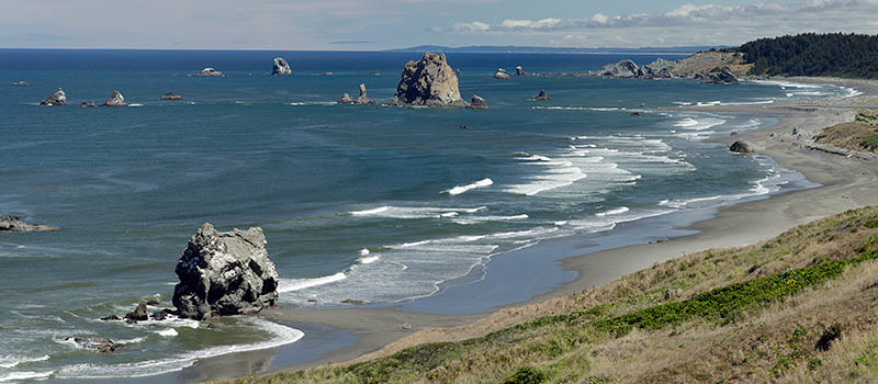 OR: South Coast Region, Curry County, North Coast, Cape Blanco Area, Cape Blanco State Park, View of Cape Blanco with its quiet, protected beach, large hoodoos, and grass-topped cliffs [Ask for #274.686.]
