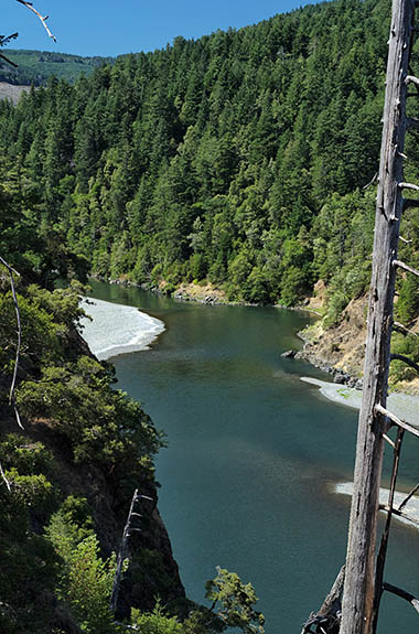 OR: Curry County, Coast Range, Rogue River Area, Illinois River Area. The Rogue River passes through a cliff-lined gorge; viewed from the byway [Ask for #274.786.]