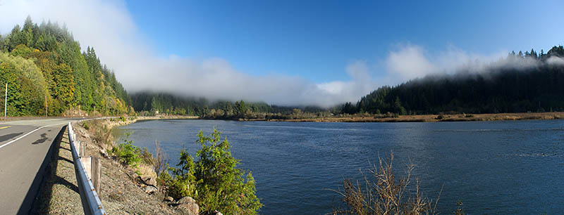 OR: Douglas County, Coast Range, Smith River Area, Lower Smith River, The Smith River Road hugs the tidal inlet at the mouth of Smith River, with panoramic views; fog. [Ask for #276.004.]