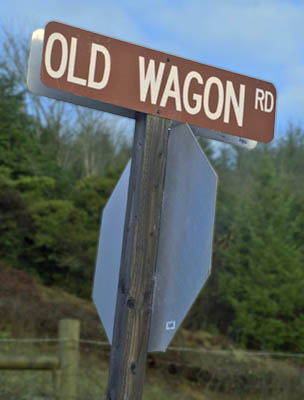 OR: South Coast Region, Coos County, The Coast Range, The Old Coos Bay Wagon Road. A county sign marks the Old Wagon Road at its intersection in Sumner Community.  [Ask for 276.243.]