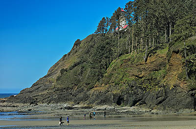 OR: South Coast Region, Lane County, Pacific Coast, Cape Perpetua Area, Heceta Head, View towards the Heceta Head Lighthouse and its cliffs from the beach below [Ask for #276.498.]