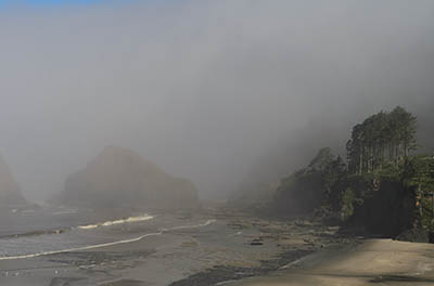 OR: South Coast Region, Lane County, Pacific Coast, Cape Perpetua Area, Heceta Head, Beach beneath the lighthouse keepers cottage, now a B&B, in fog [Ask for #276.984.]
