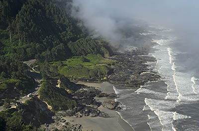 OR: South Coast Region, Lane County, Pacific Coast, Cape Perpetua Area, Cape Perpetua National Scenic Area, Cape Perpetua Overlook, View towards US 101 as it runs atop cliffs and beaches; fog [Ask for #276.993.]