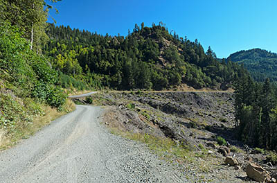 OR: Curry County, Coast Range, Sixes River, Sixes River. The gravel road that parallels the upper stretches of the river runs through a clearcut, giving views. [Ask for #277.015.]