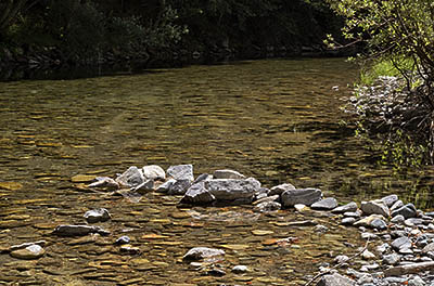 OR: Curry County, Coast Range, Elk River, Elk River. River rocks extend into the river at a gravel bar [Ask for #277.026.]