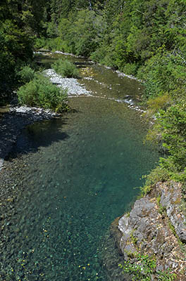 OR: Curry County, Coast Range, Elk River, Butler Bar Campground. A cliff sided gorge empties into gravel bars; the campground fronts on the flats. [Ask for #277.033.]