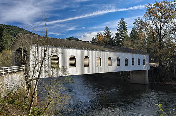 OR: Lane County, South Willamette Valley, Eugene Area, Goodpasture Covered Bridge. Oregon's longest covered bridge still in use, Goodpasture regularly carries logging trucks. [Ask for #277.387.]