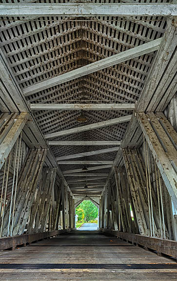 OR: Lane County, South Willamette Valley, Eugene Area, Office Covered Bridge. Red covered bridge, carrying traffic to a local park. At 180 feet, this is Oregon's longest covered bridge. Interior, showing details of Howe truss. [Ask for #277.403.]
