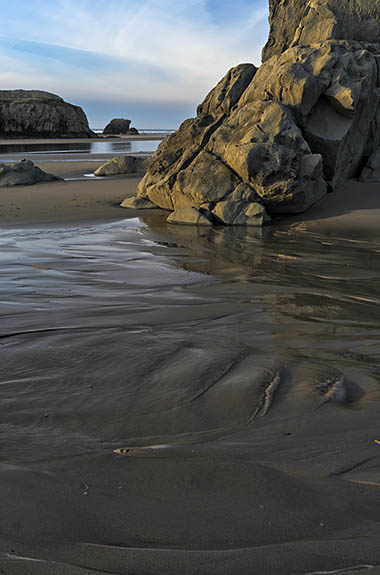 OR: Coos County, Bandon Area, South Beaches, Devils Kitchen State Wayside. Sunset beach view over a sea spire in the sand, on receding tide [Ask for #278.035.]